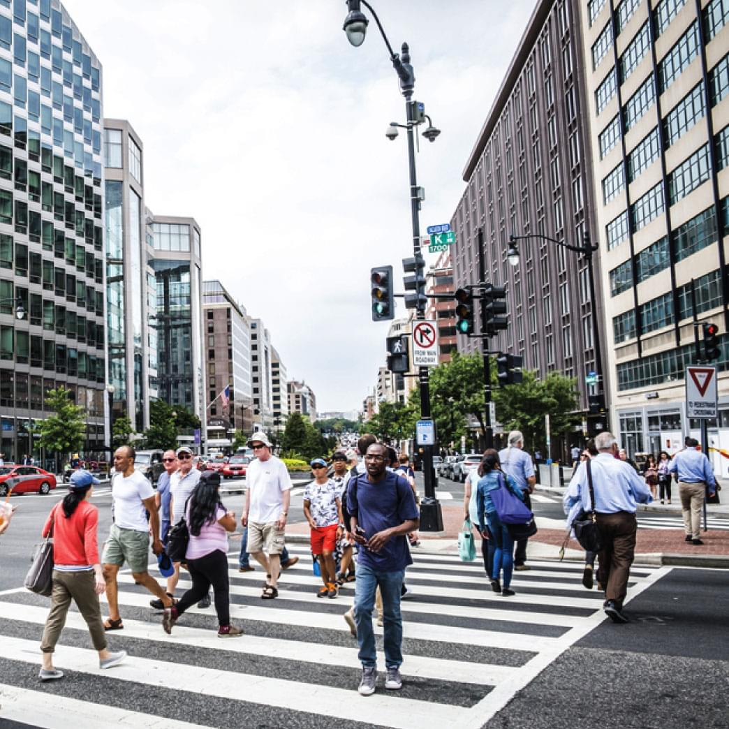 people crossing downtown city street