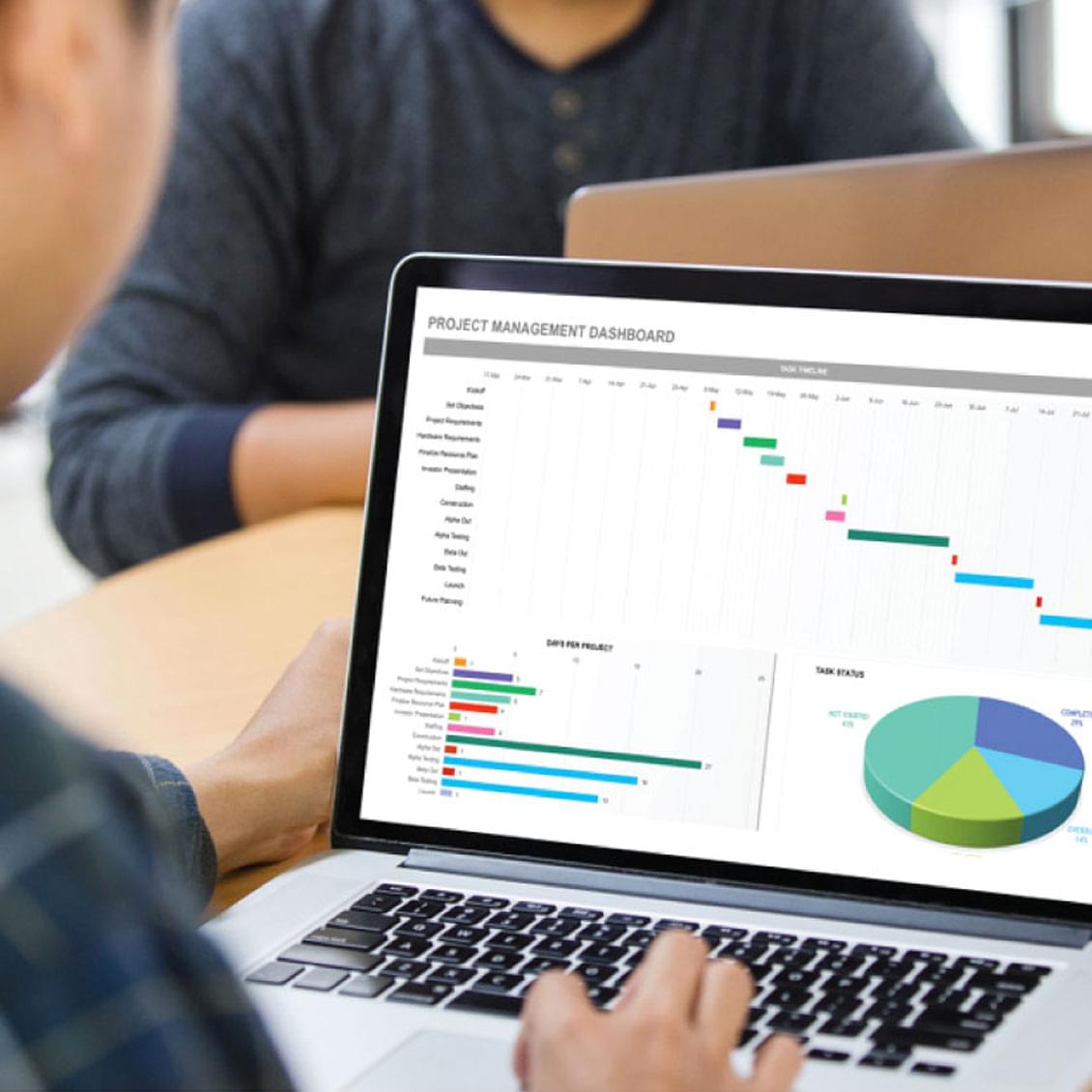 laptop showing project management dashboard in MaintStare enterprise asset management software